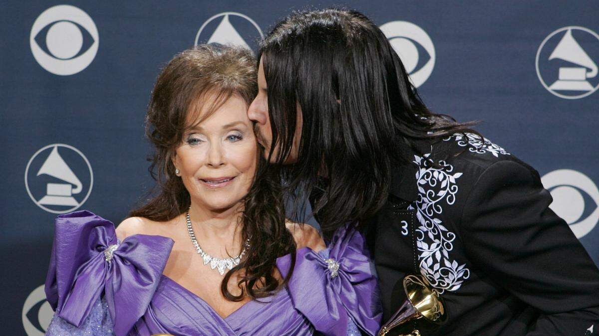 Loretta Lynn and Jack White pose with their awards for best country collaboration with vocals for “Portland Oregon” at the 47th Annual Grammy Awards on Sunday, Feb. 13, 2005, at the Staples Center in Los Angeles. Lynn also won for best country album for “Van Lear Rose.”