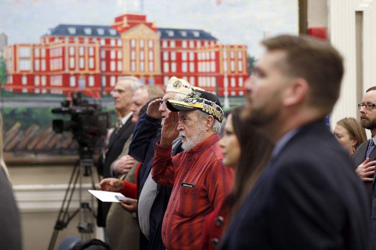 The crowd honored the National Anthem Tuesday at a news conference where the Affordable Housing fund, AU Associates and the Veterans Administration announced the creation of a new affordable housing project. on the grounds of the on the grounds of the Franklin R. Sousley VA Campus, 2250 Leestown Road.