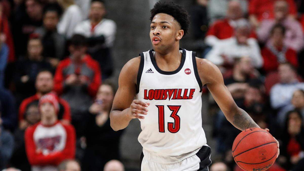 Louisville guard David Johnson (13) took the ball up the court against Syracuse on Feb. 19, 2020, in Louisville.