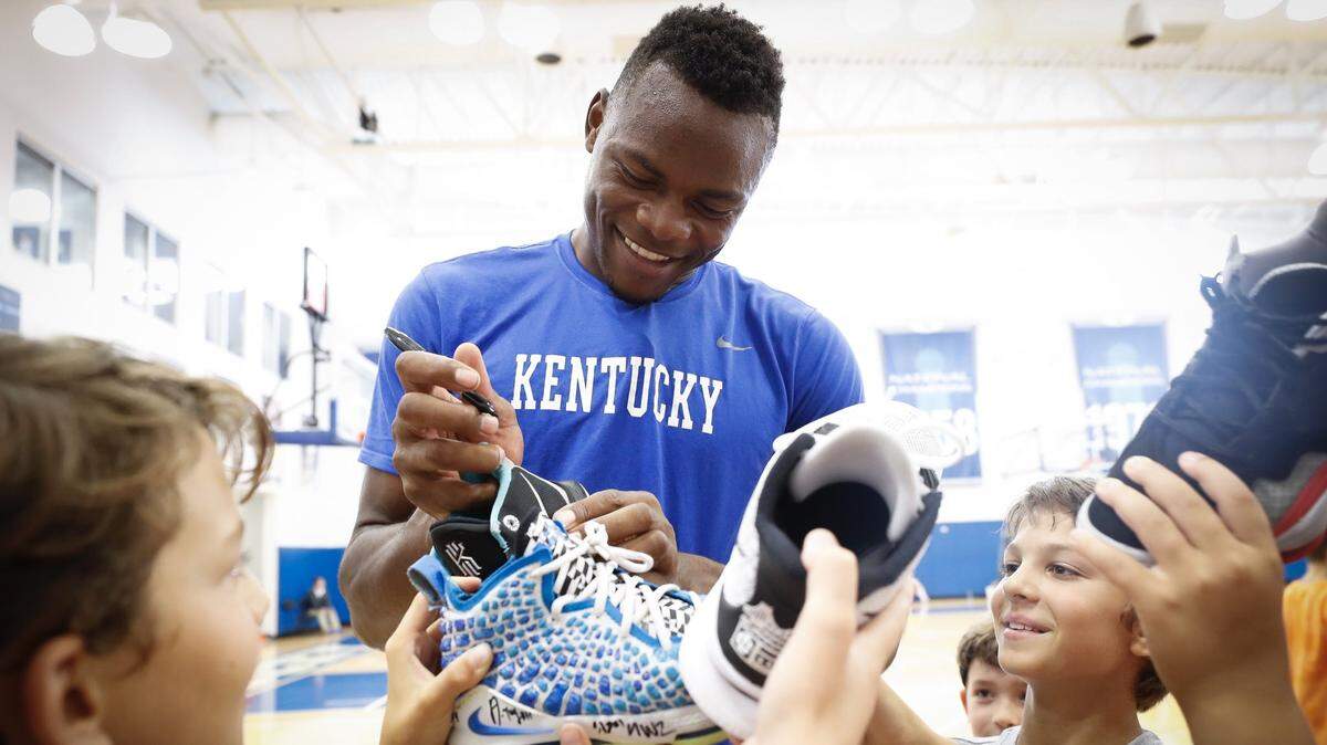 Kentucky forward Oscar Tshiebwe signed shoes for participants during a Wildcats basketball camp in June. Tshiebwe said during Sunday night’s Pro Day broadcast that he’s set some big goals for the upcoming season.