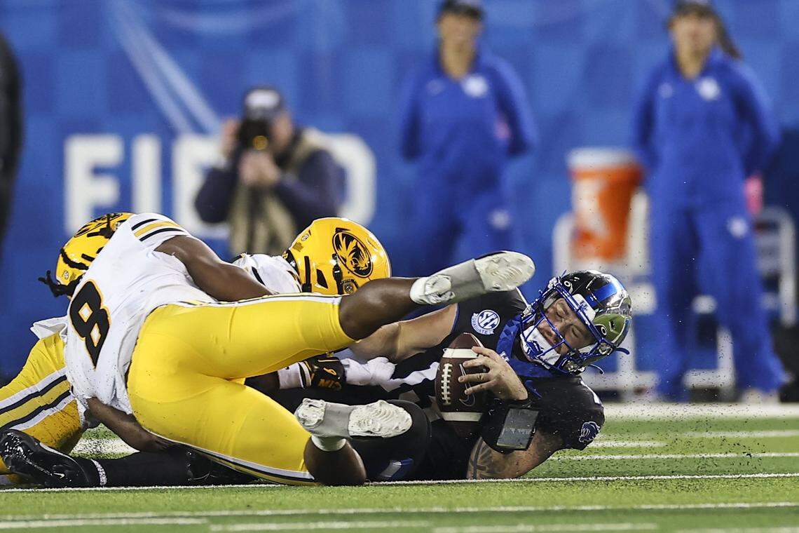 Kentucky Wildcats quarterback Devin Leary (13) is tackled by the Missouri Tigers defense during the game at Kroger Field in Lexington, Ky, Saturday, October 14, 2023.