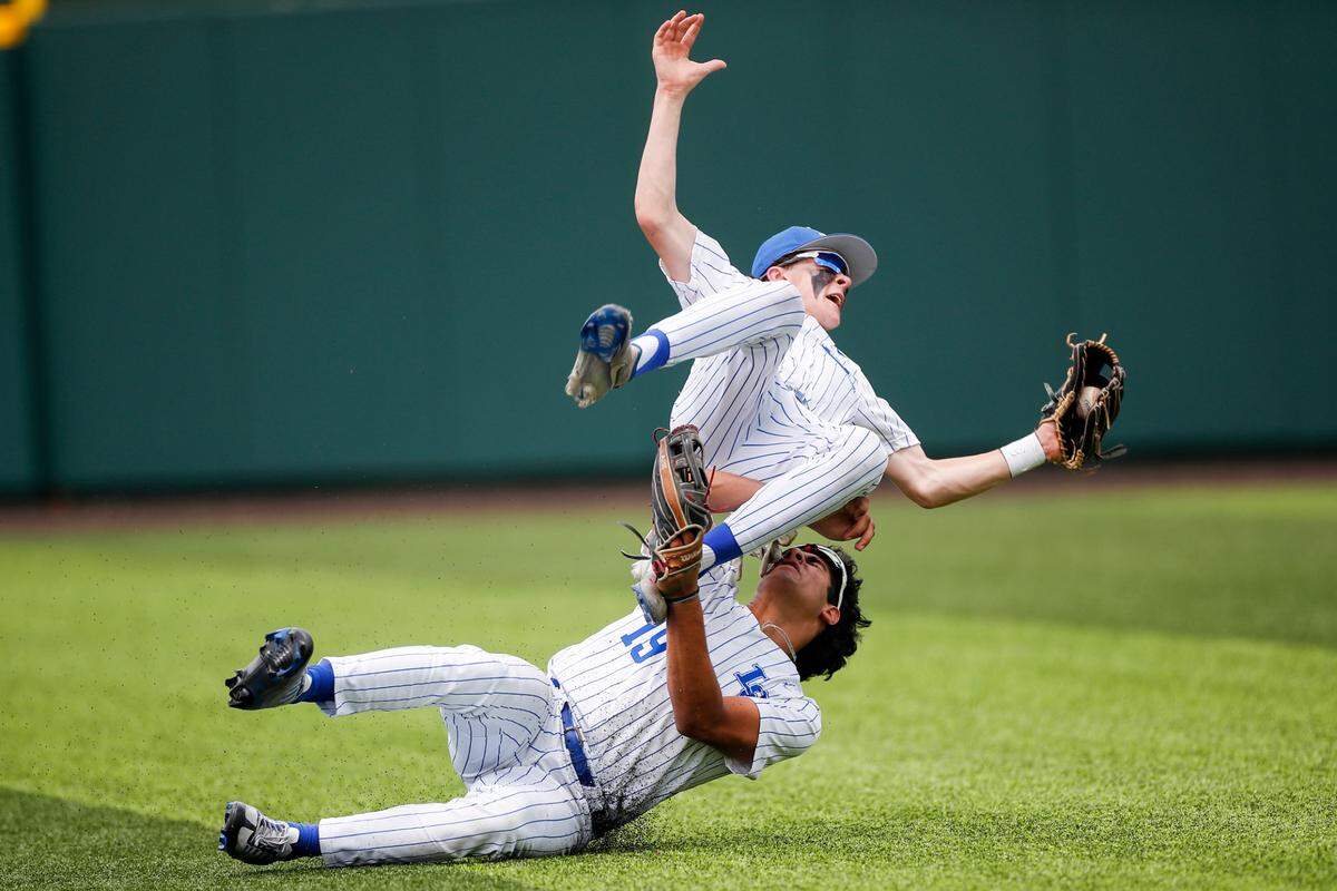 Lexington Catholic outfielder Zachery Ryan (19) collides with a teammate trying during the KHSAA Baseball State Tournament at Counter Clocks Field in Lexington, Ky., Saturday, June 3, 2023. The Knights lost to Apollo, 7-3 in the quarterfinals.