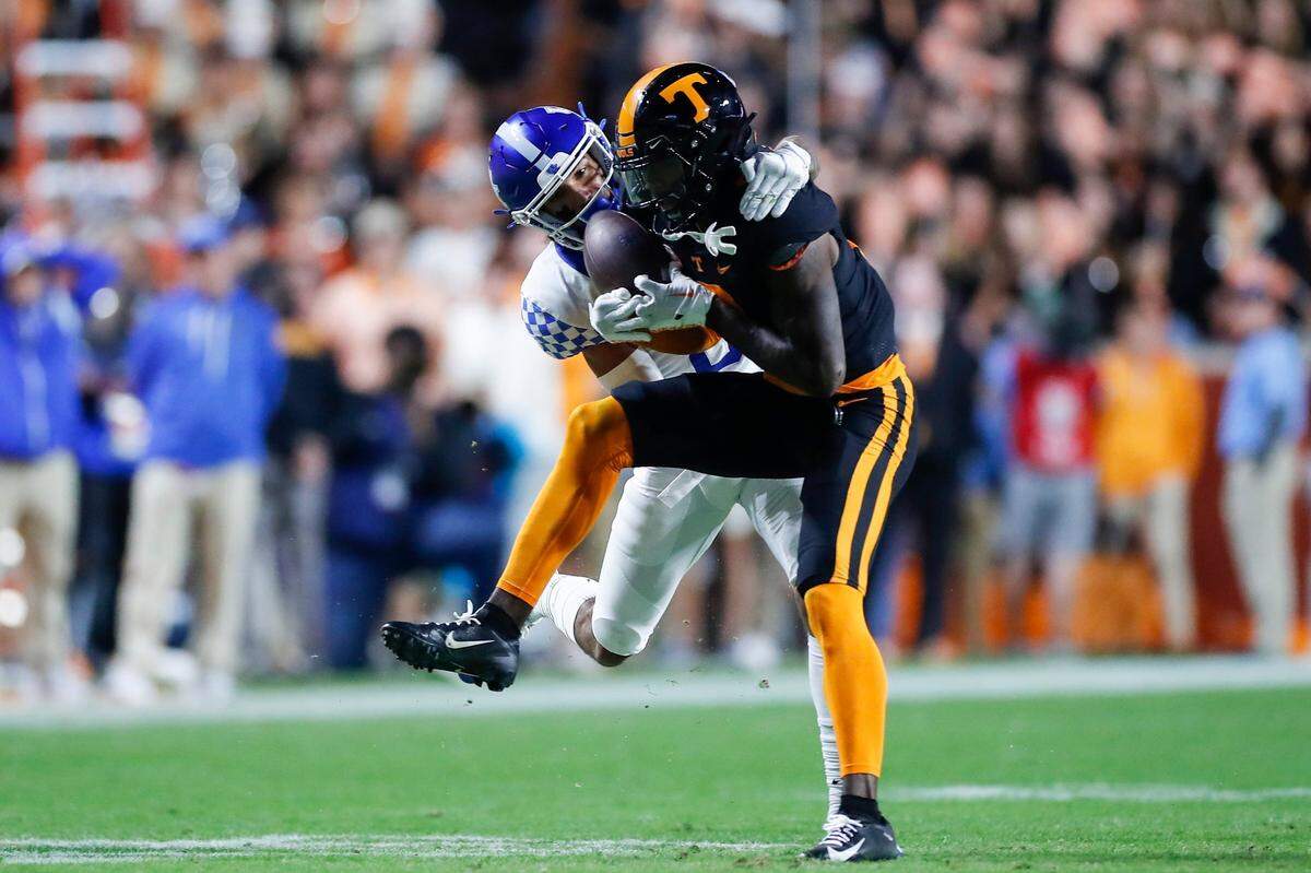 Tennessee’s Juwan Mitchell, right, intercepts a pass intended for Dane Key this past Saturday. It was one of three picks UK QB Will Levis threw against the Vols.