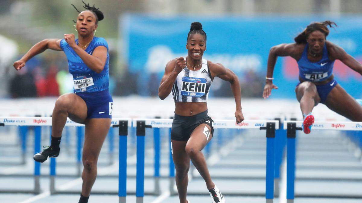 Keni Harrison, center, outran fellow former Kentucky star Jasmine Camacho-Quinn, left, and Nia Ali, right, during the women’s 100-meter hurdles at the Drake Relays.