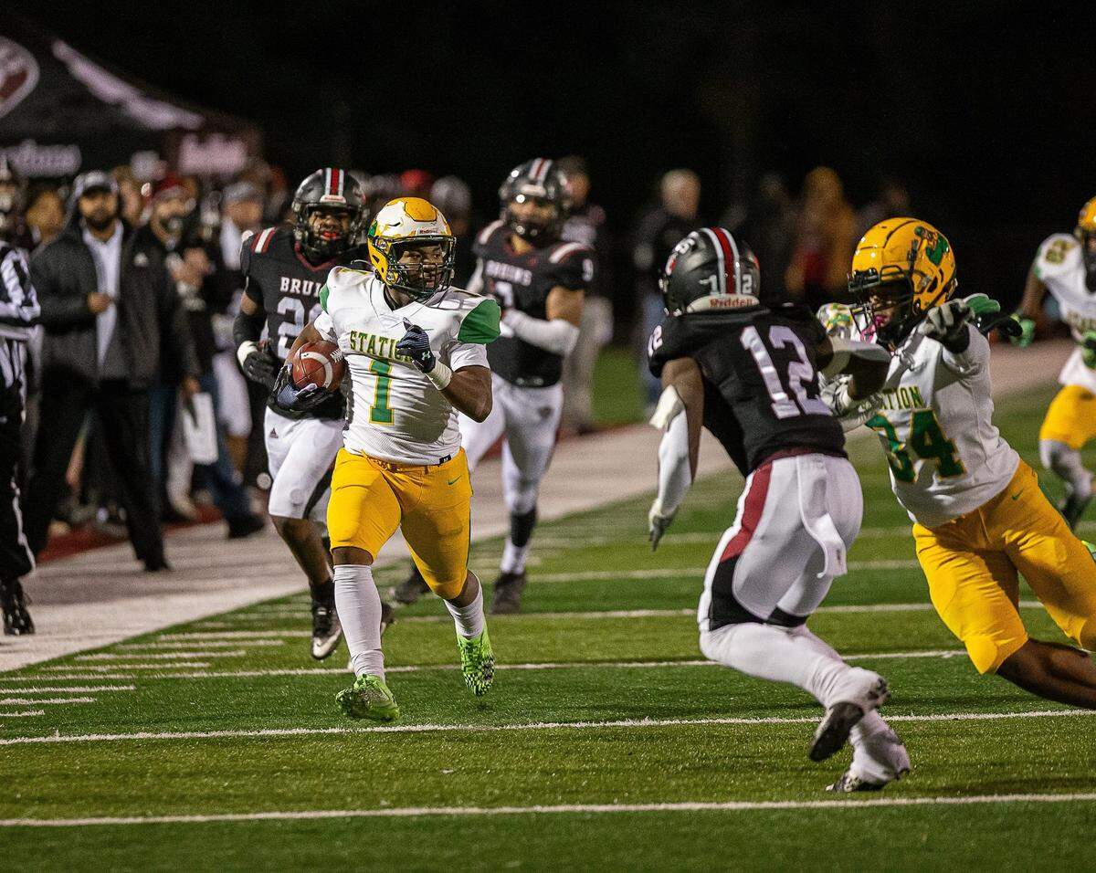 Bryan Station running back Kalen Washington (1) carried 22 times for 106 yards and a touchdown in the Defenders’ win at Ballard.