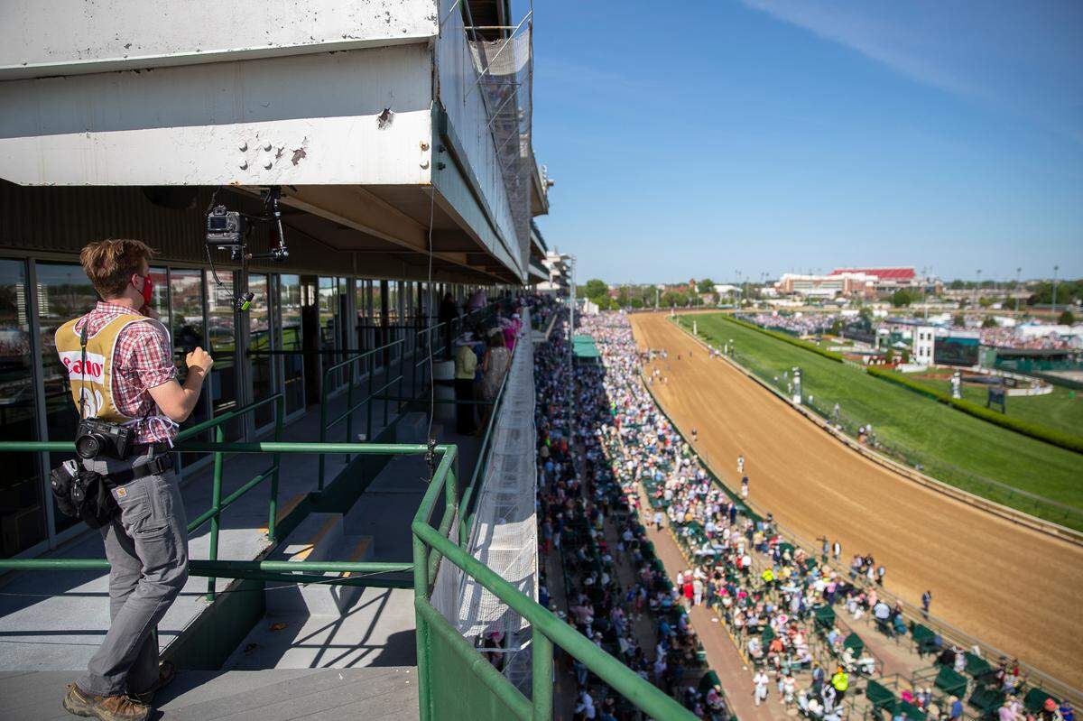 Herald-Leader photographer Silas Walker sets up a remote camera on Millionaires Row at Churchill Downs.