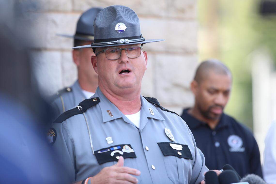 Kentucky State Police Trooper Scottie Pennington delivers a press conference providing more details of the ongoing search efforts for the Laurel County shooting suspect Joseph Couch, on September 9, 2024, in London, Ky.