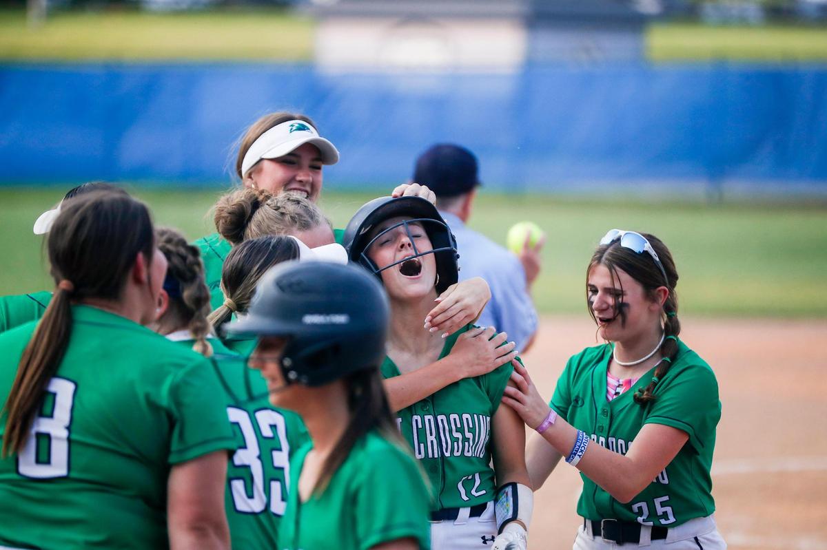 Great Crossing’s Ryann Livingston (12) celebrates her two run home run in the seventh inning Wednesday night that tied the game 2-2 and forced extra innings.