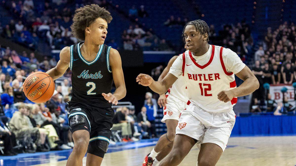North Oldham's Rajon Pierre Rondo (2) drives past Butler's Henrich Barjolo (12) during a quarterfinal round game in the 2026 UK Healthcare Boys' Basketball Sweet 16 state tournament, Friday, March 20, 2026 at Rupp Arena in Lexington, Ky.
