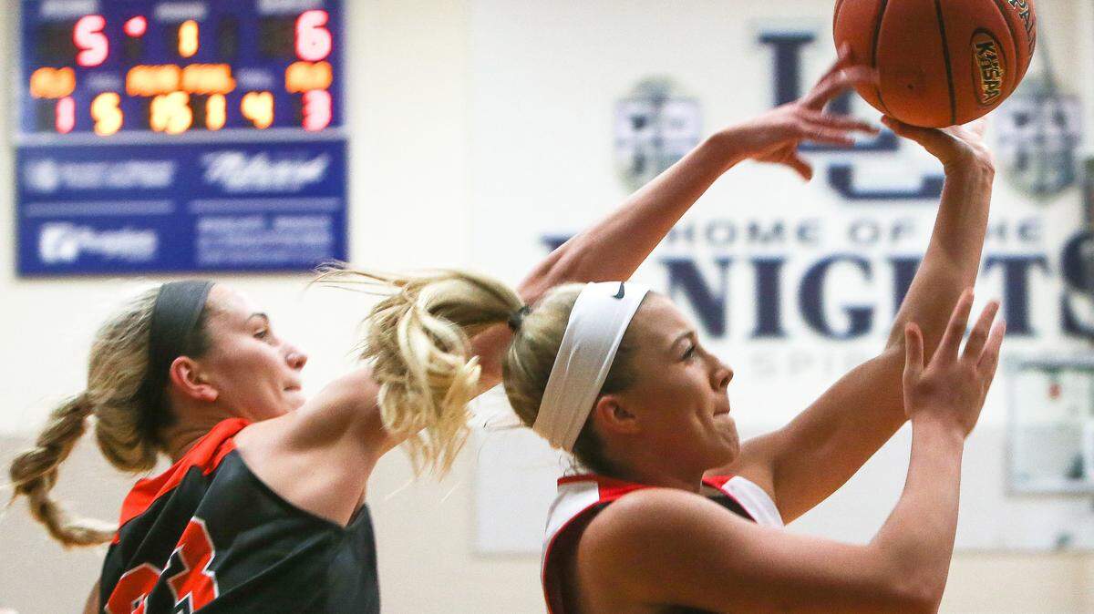 Ryle’s Maddie Scherr blocked a shot by Boyd County’s Harley Paynter during the Traditional Bank Holiday Classic at Lexington Catholic last December. Scherr was named Kentucky’s Gatorade Player of the Year on Friday.