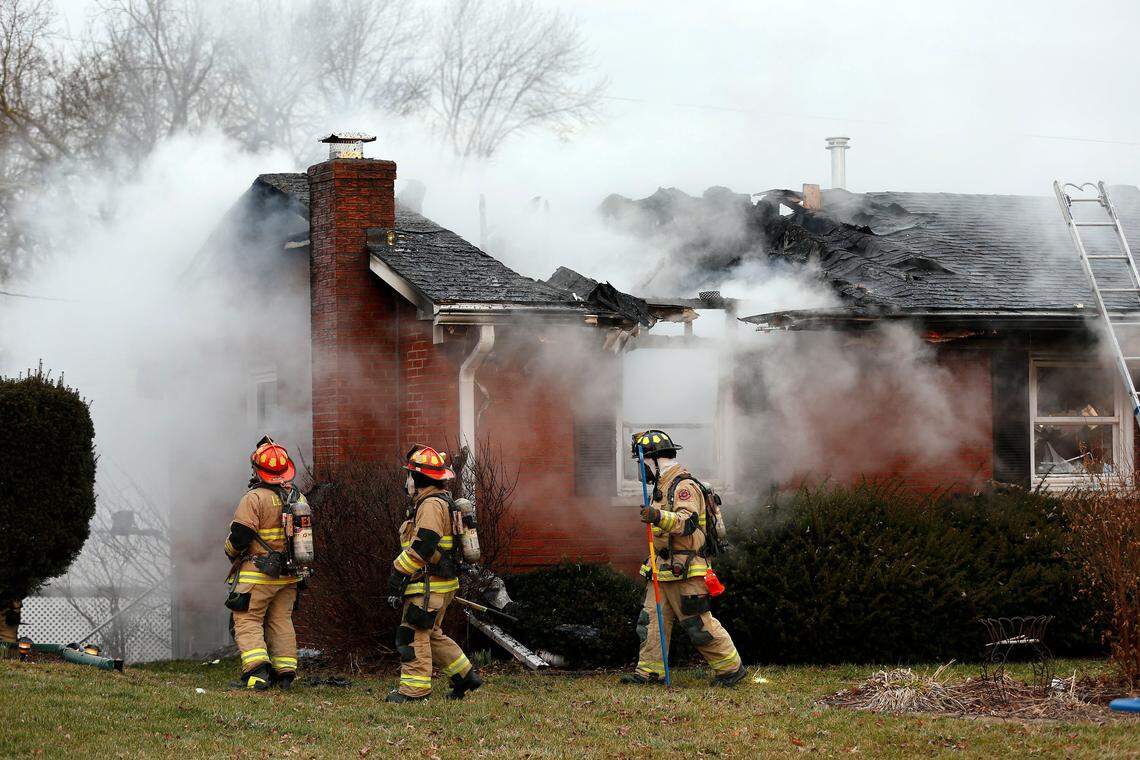 Lexington Fire Department firefighters worked to extinguish a fire at the house at 1921 Glengarry Way Monday, Jan. 28, 2019.