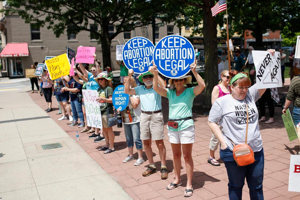 Protesters cheer and gather outside the courthouse during the Rise Up 4 Abortion Rights protest in downtown Lexington, Ky., Saturday, May 14, 2022.