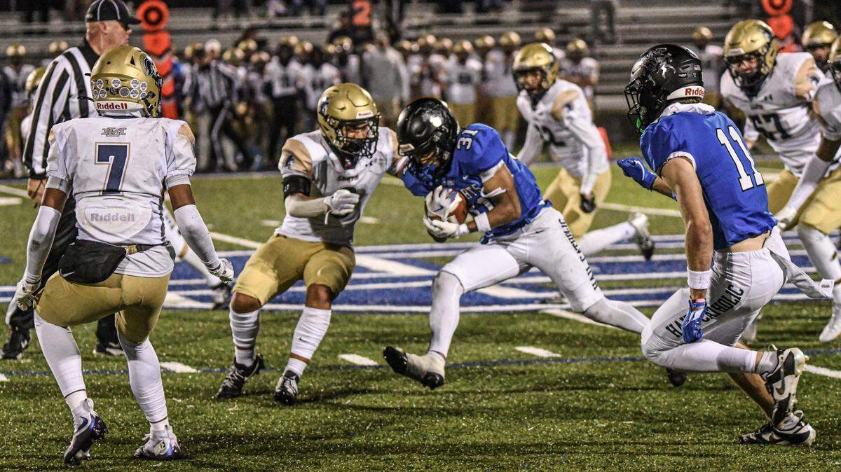 Lexington Catholic’s Aven Blair, shown here in a game earlier this season, had three rushing touchdowns and an interception Friday against Bell County.