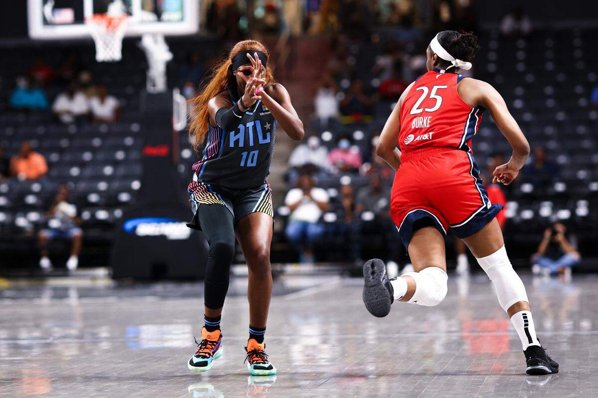 Rhyne Howard of the Atlanta Dream celebrates making a shot during a game against the Washington Mystics this season. Howard received 53 of a possible 56 votes in being named WNBA Rookie of the Year on Thursday.