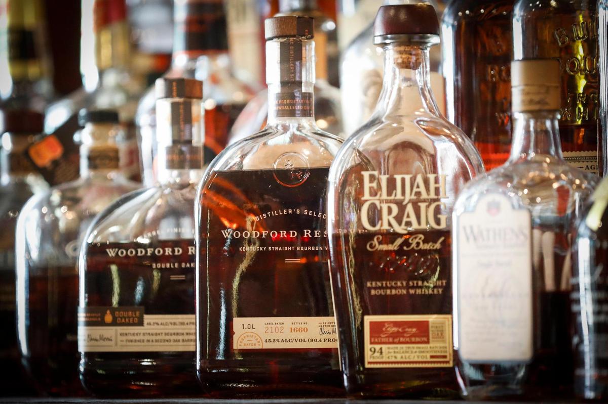 Bottles of bourbon sit behind the bar at The Goose of Lexington in Lexington, Ky., Wednesday, May 5, 2021.