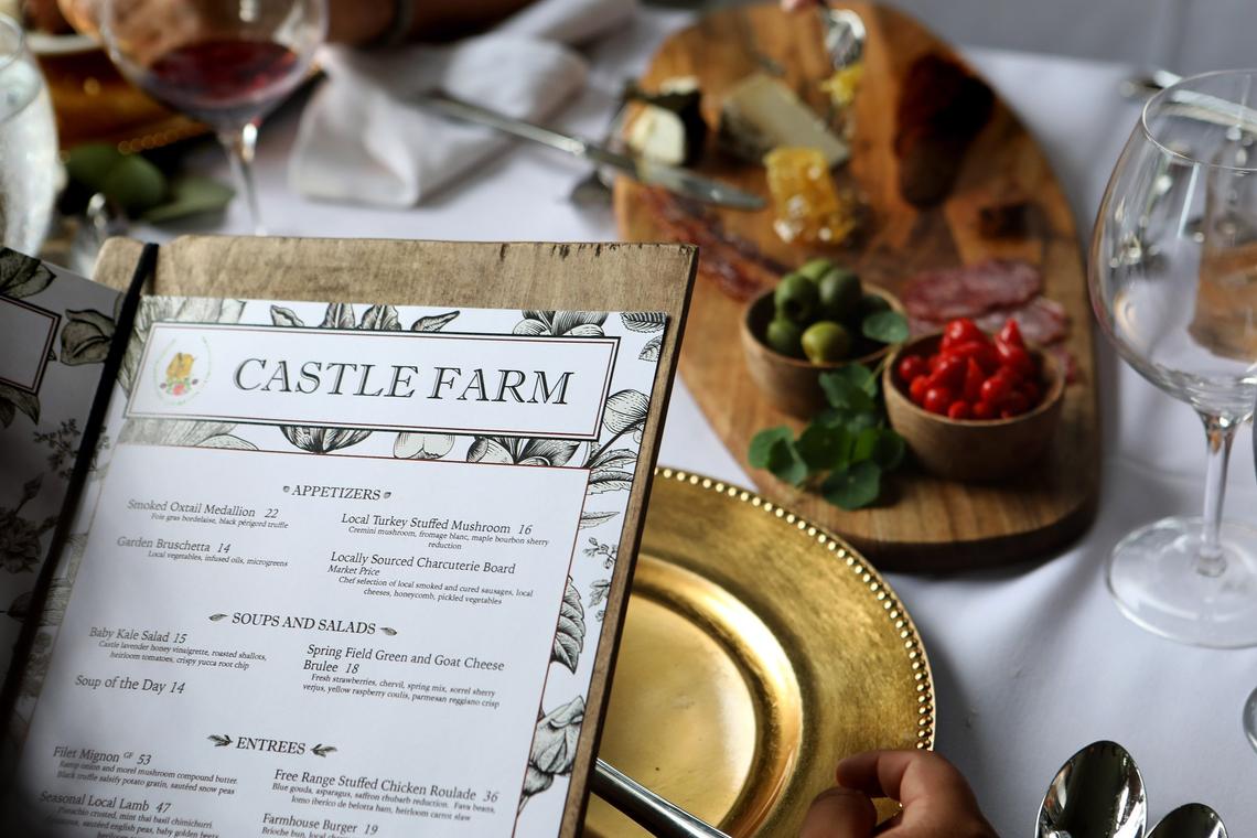 Menu with locally sourced charcuterie board at Castle Farm restaurant in The Kentucky Castle.