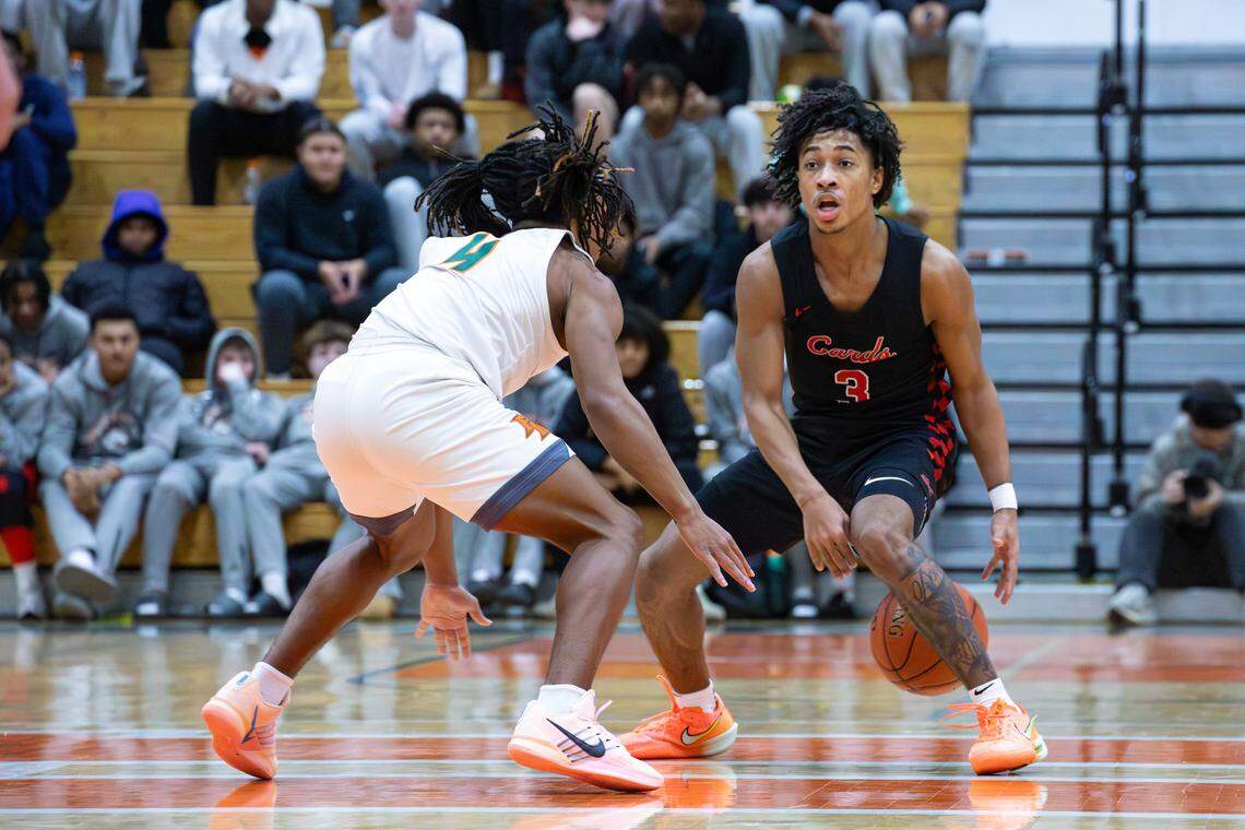 GRC's Malachi Ashford (3) shakes Douglass's Dakari Talbert (4) mid-court, looking for an open teammate during the George Rogers Clark vs Frederick Douglass basketball game on Jan. 10, 2026, in Lexington, Ky.