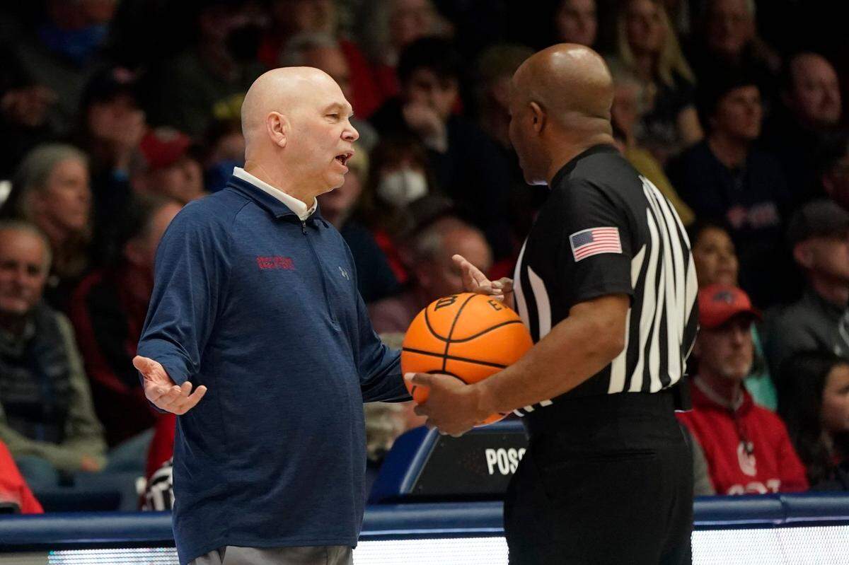 Saint Mary’s head coach Randy Bennett talks with an official during an NCAA college basketball game against Gonzaga in Moraga, Calif., Saturday, Feb. 26, 2022. (AP Photo/Jeff Chiu)