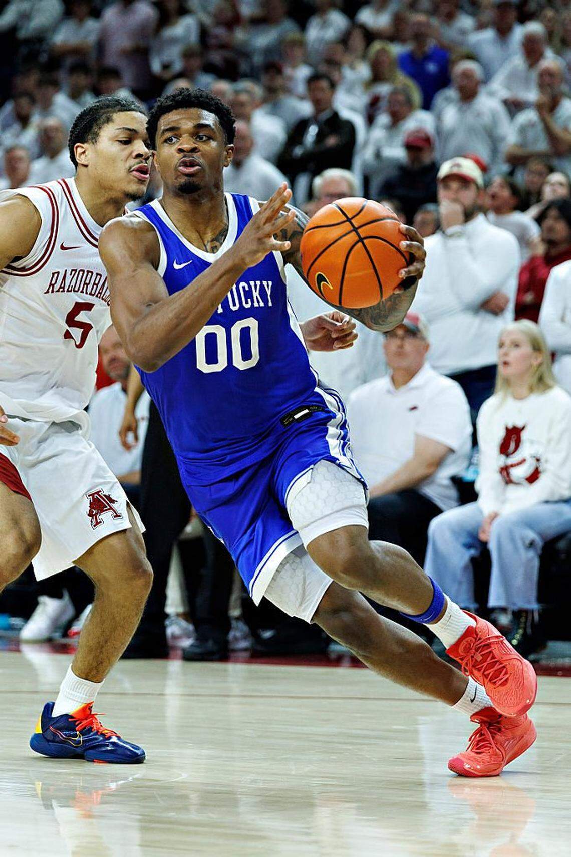 Kentucky guard Otega Oweh (00) had 24 points, eight rebounds and three assists and made 9 of 12 field-goal attempts to lead UK’s 85-77 upset of No. 15 Arkansas last Saturday at Bud Walton Arena in Fayetteville.