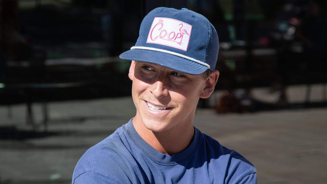 Senior, Meier Patrick smiles thinking about his time at UK, and having lunch with his younger brother, who's a freshman outside the Gatton Student Center during UK's first day of the fall semester on August 25, 2025, in Lexington, Ky.