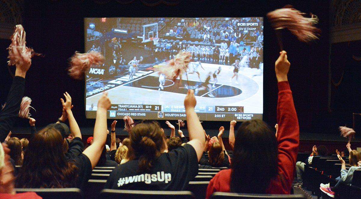 Fans of the Transylvania women’s basketball team watch the NCAA Division III Tournament championship game on Saturday at the Kentucky Theatre. Watch parties for the game were held in Lexington, Louisville and other cities around Kentucky.