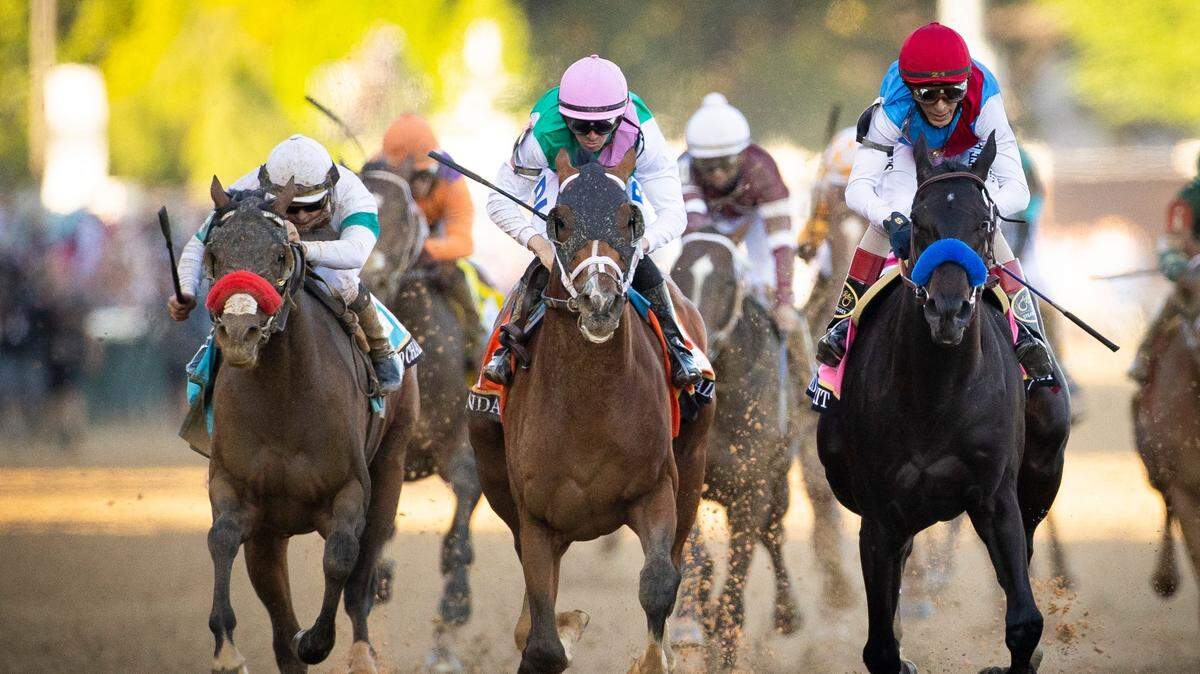 Mandaloun, center, will be making his first appearance at Churchill Downs on Saturday since finishing second to Medina Spirit, right, in the 2021 Kentucky Derby. Mandaloun earlier this year was declared the official champion of the Run for the Roses after a failed drug test forced the disqualification of Medina Spirit.