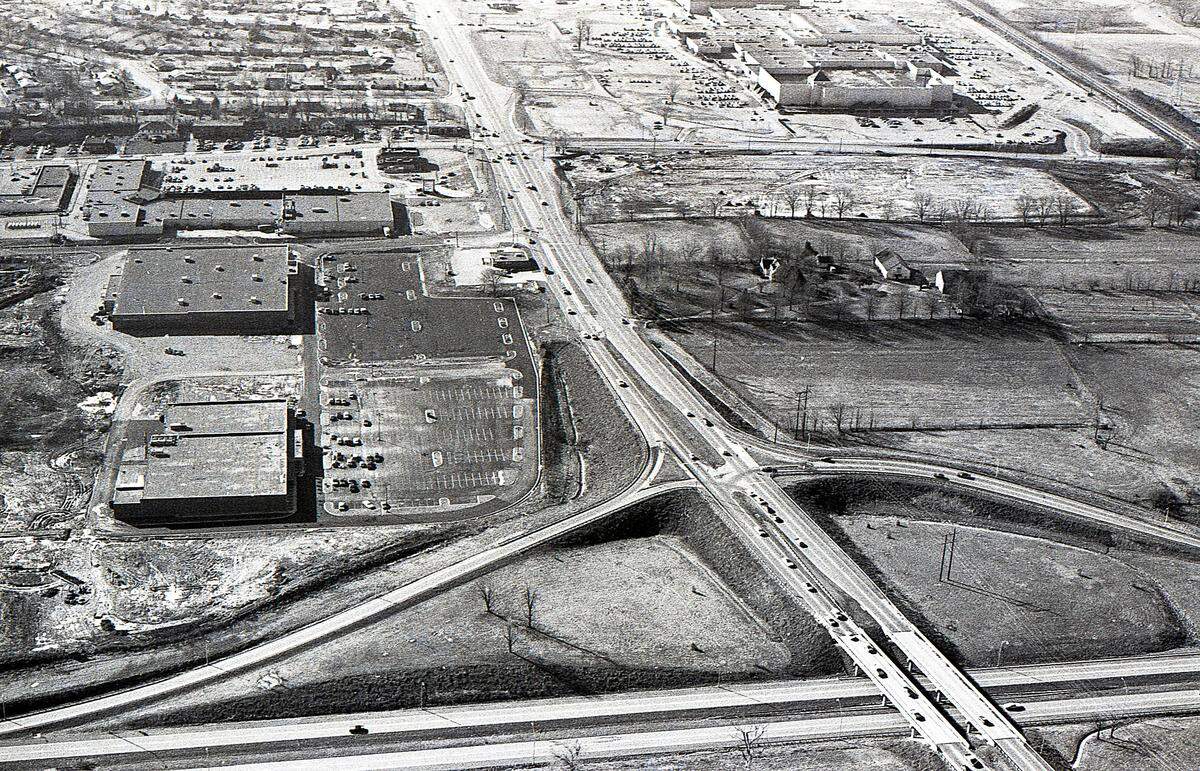 The intersection of New Circle, running across the bottom of the photo, and Nicholasville roads, in late January, 1976 in Lexington, Ky. The South Park Shopping Center is on the left side of the image. Stores there included Mac Donald Sales Center, Kroger, Hills Department Stores and Super-X store as construction continued with developers scraping plans for a 99-room hotel. On the right side of the image, the farmland, is the site of what would later become Lexington Green shopping center, it opened in 1986. Just above it is the beginning construction of Gold Circle Department Store, which today is Target. And above that, in the upper right corner of the image, is Fayette Mall, which opened in 1971. At the time of this image, traffic was becoming a major concern at what would eventually become one of Lexington’s busiest intersections.