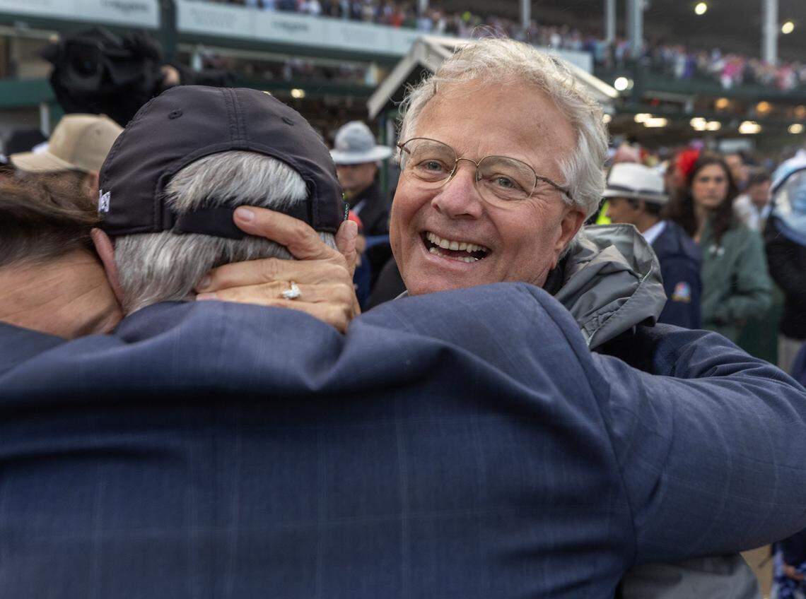 Trainer Bill Mott receives a hug after his colt, Sovereignty, won Saturday’s Kentucky Derby over Journalism.