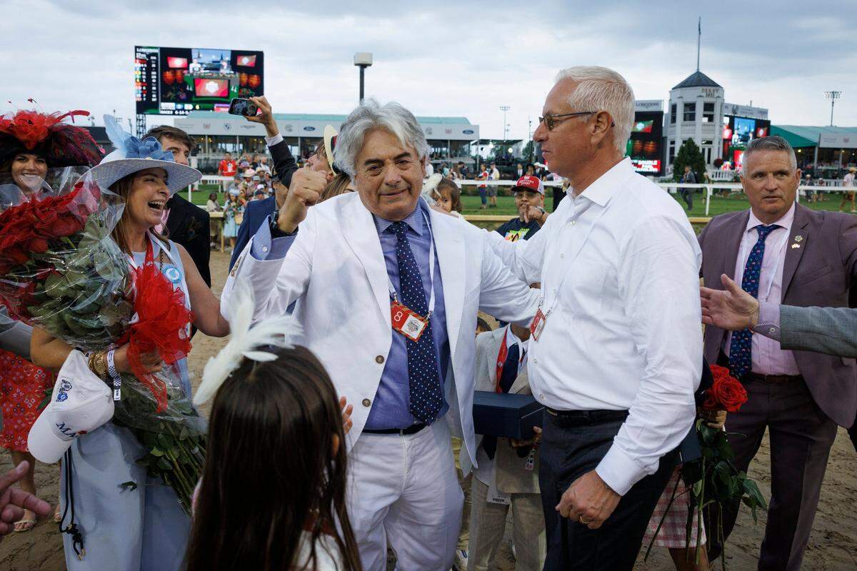 Gustavo Delgado is congratulated by fellow trainer Todd Pletcher after Mage’s Kentucky Derby victory. “I like Gustavo a lot. I was very happy for him,” Pletcher said Sunday.