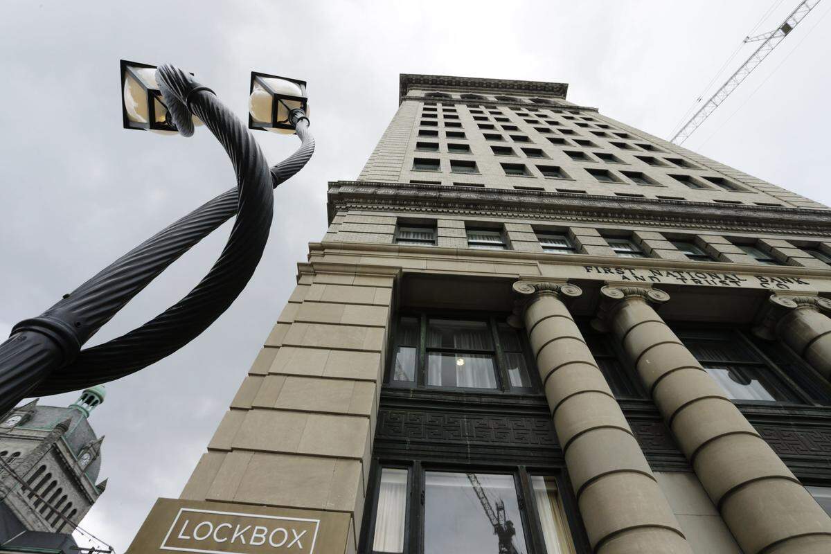 A sculpture of intertwined street lights outside 21c in Lexington.  The upscale hotel in the over 100-year-old bank tower building houses a museum, restaurant on West Main Street. 
