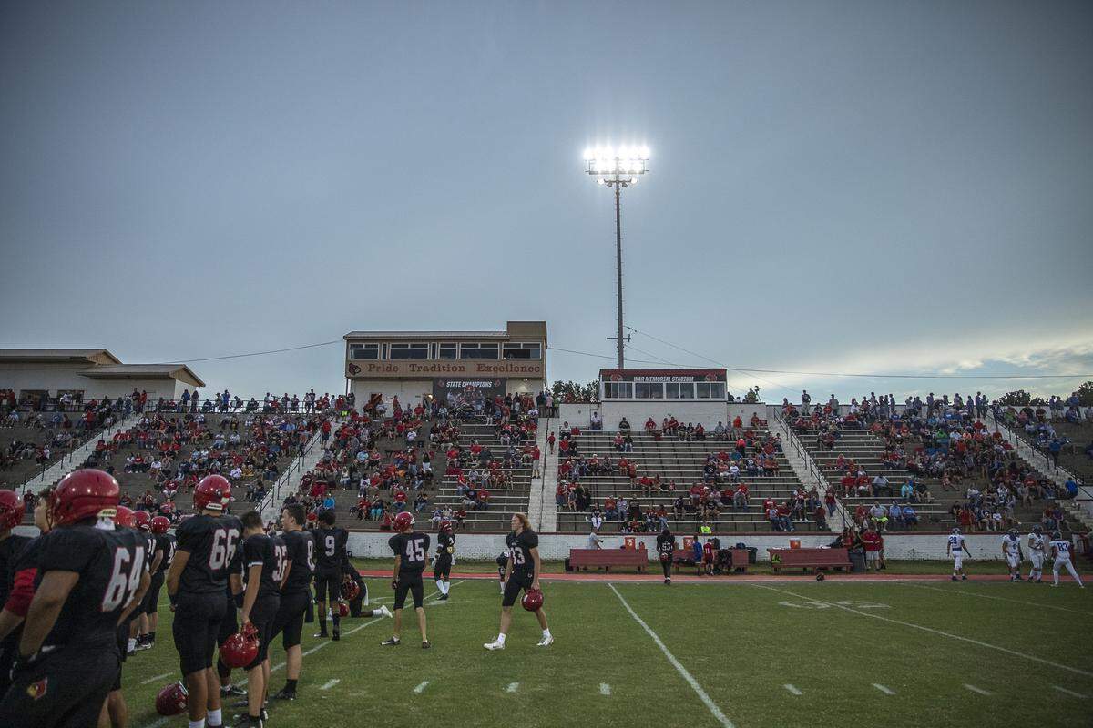 The Cardinals warm up at War Memorial Stadium.