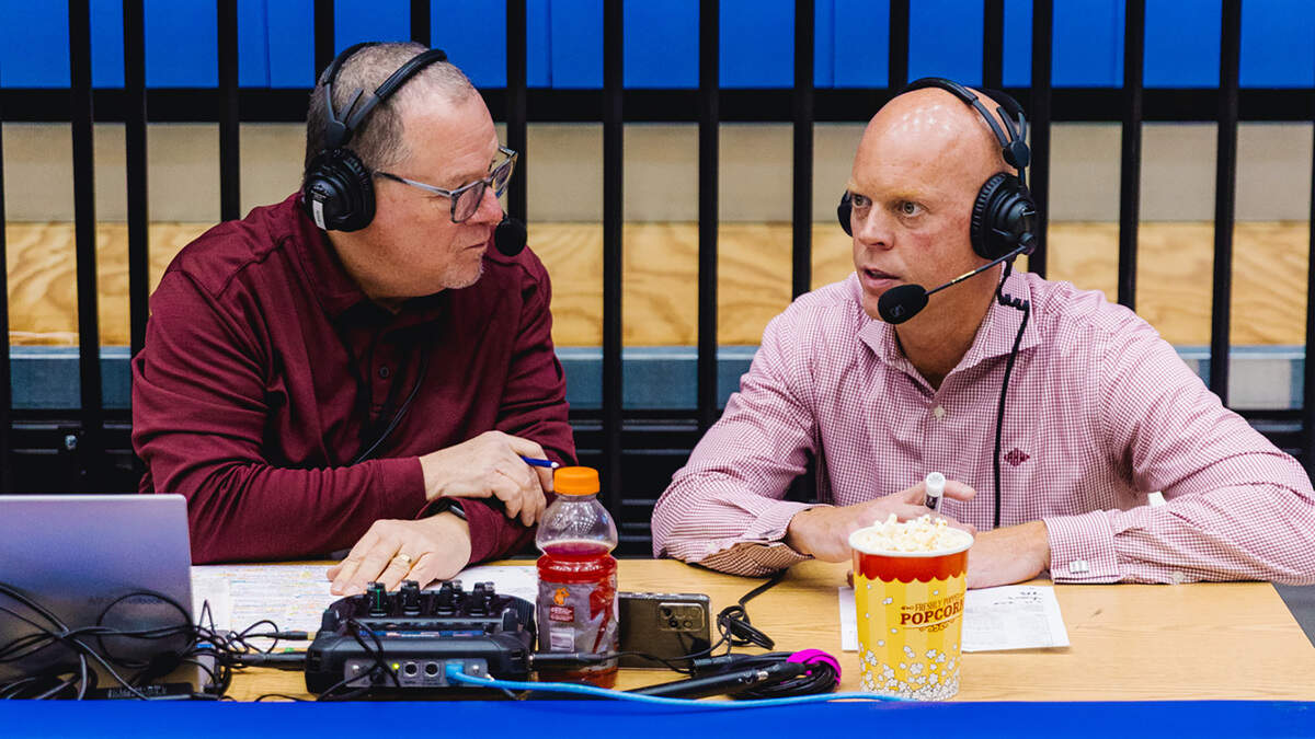 Longtime Eastern Kentucky University Colonels radio play-by-play announcer, Greg Stotelmyer, left, interviewed EKU men’s basketball coach A.W. Hamilton following a game. Stotelmyer, 70, announced Thursday he was retiring as “voice of the Colonels” after more than four decades in the role.