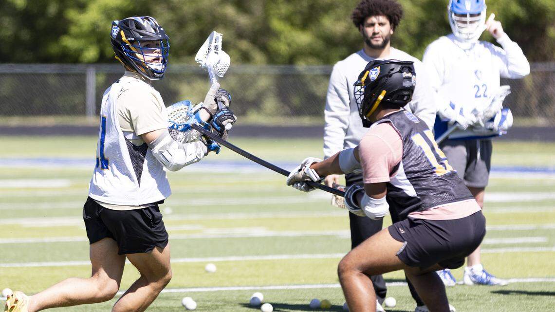 Henry Clay’s Max Thayer looks for a shot around teammate Andres Ordonez during a practice at Henry Clay High School on Monday.