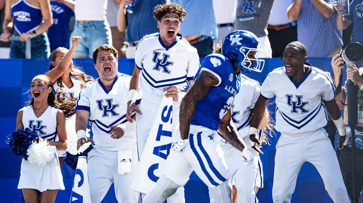 Kentucky’s cheerleaders celebrate a touchdown by running back Seth McGowan (3) during the Wildcats’ season-opening win against Toledo on Aug. 30 at Kroger Field.