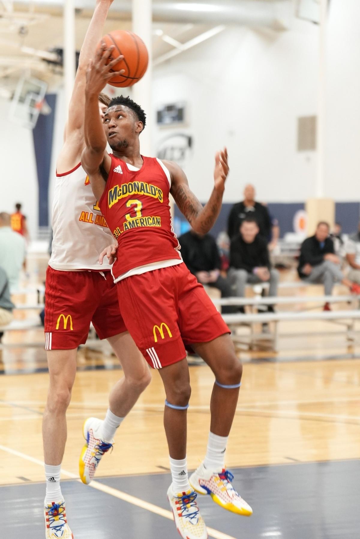 Justin Edwards attempts to shoot the ball against a defender during practice ahead of the McDonald’s All-American Game in Houston. Edwards recently won a second straight state championship in Pennsylvania.