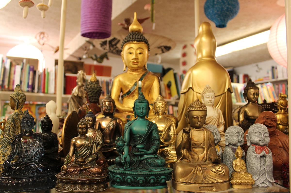Spiritual statues sit on a shelf at Sqecial Media, a gift shop in Lexington, Kentucky, on Monday, Nov. 18, 2024.