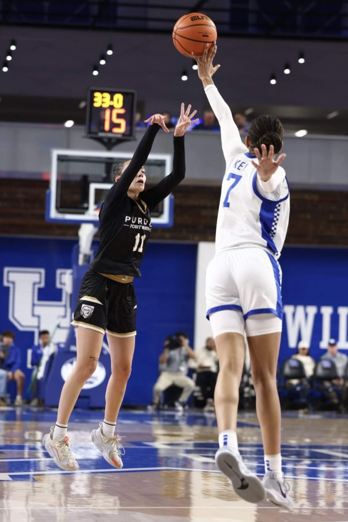 Kentucky’s Teonni Key (7) blocks a shot by Purdue Fort Wayne’s Sydney Freeman on Monday night. UK blocked 11 shots during Monday night’s win in Memorial Coliseum, and Key had five of them.
