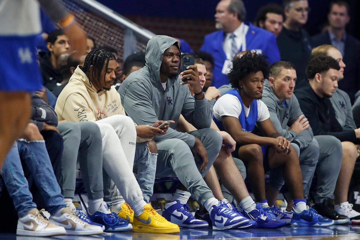 Kentucky basketball star Oscar Tshiebwe watches his teammates from the bench during Big Blue Madness at Rupp Arena on Oct. 14.
