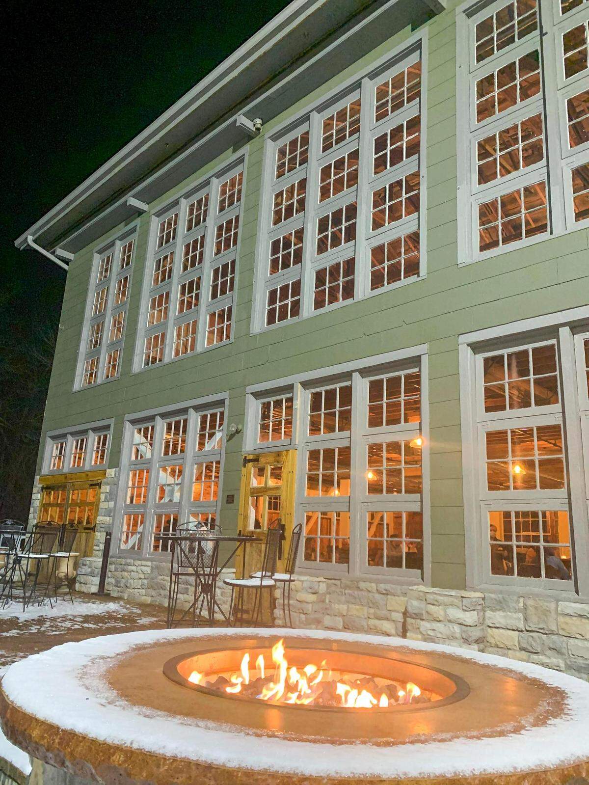 The entrance to Honeysuckle shows off the original windows of the former Churchill Weavers loom house.