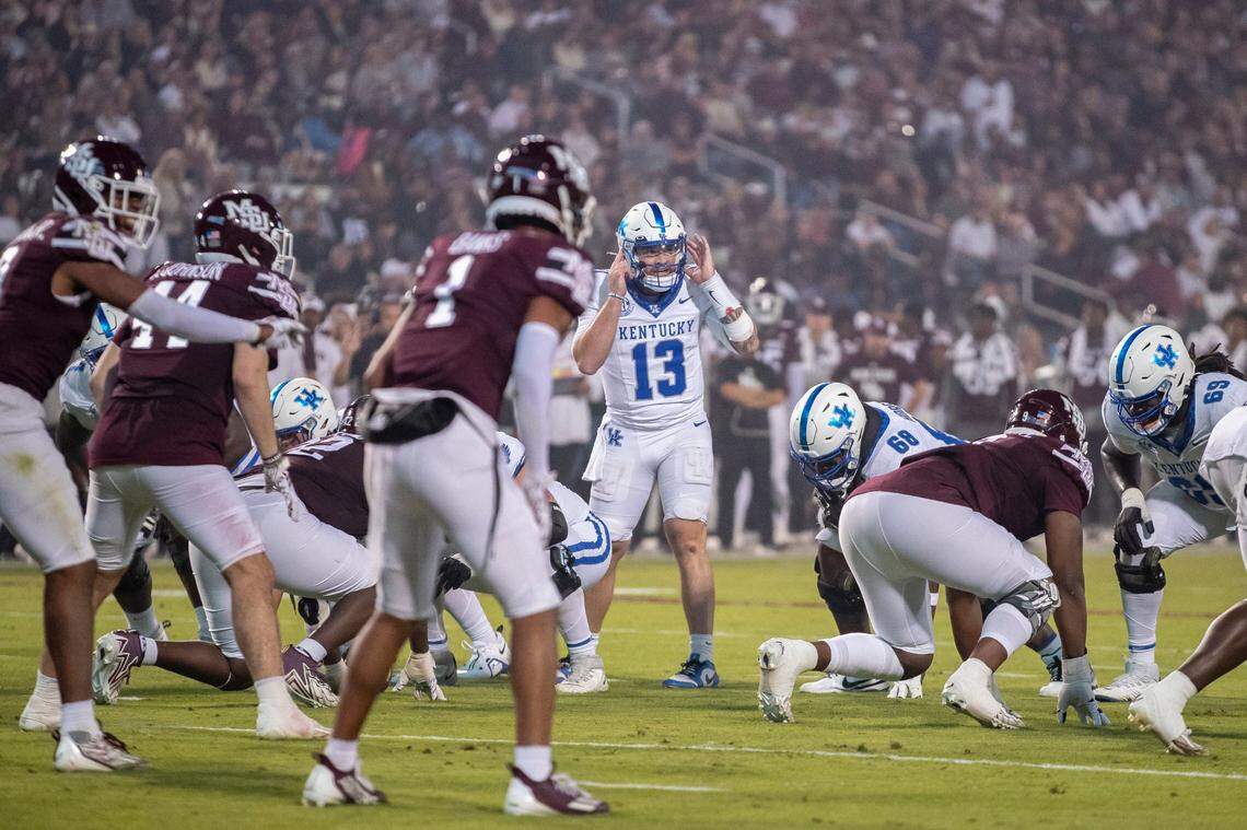 Kentucky quarterback Devin Leary (13) talks to his teammates during Saturday’s game against Mississippi State.