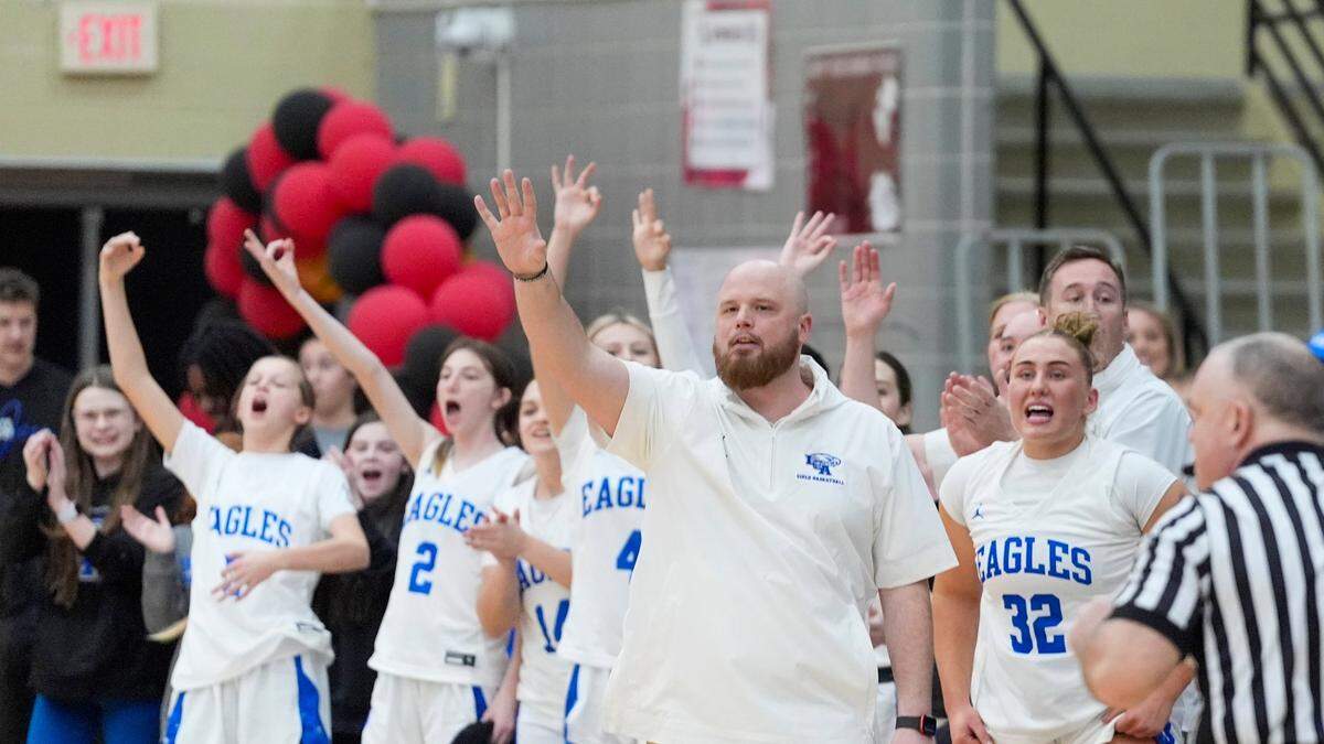 Head coach Tim Bradshaw and his LCA bench celebrate during the Eagles’ semifinal win Wednesday night, which propelled them into the 11th Region Tournament for the first time in 15 years.