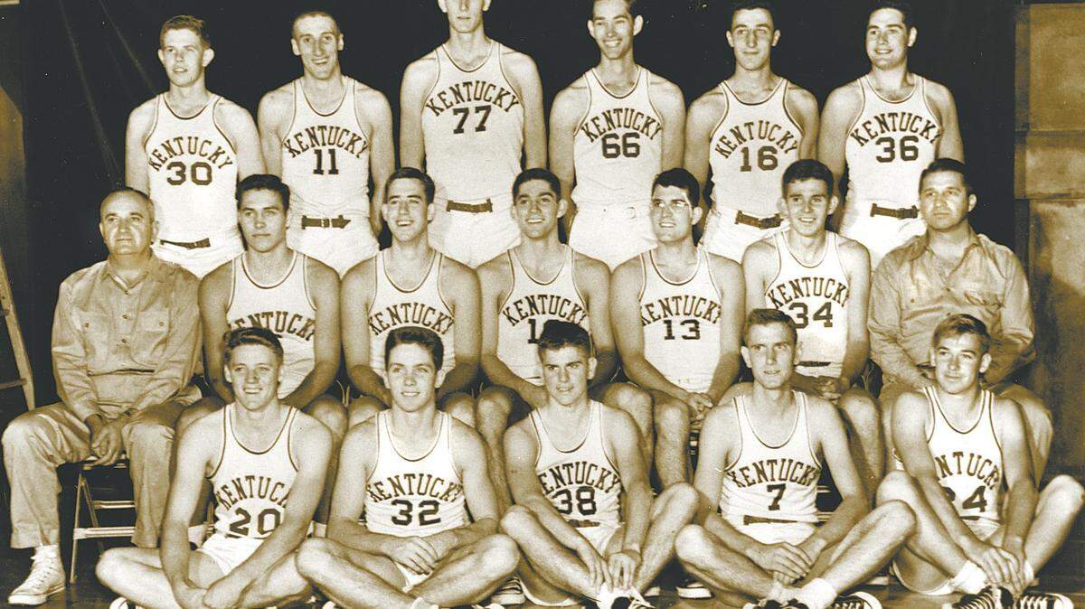 1951 NCAA Champions, University of Kentucky 1950-51: Top row: Frank Ramsey, Shelby Linville, Bill Spivey, Roger Layne, Lou Tsioropoulos, Read Morgan. 
Middle row: Coach Adolph Rupp, Cliff Hagan, C.M. Newton, Walt Hirsch, Paul Lansaw, Dwight Price, Assistant Coach Harry Lancaster. 
Bottom row: Lindle Castle, Lucian Whitaker, Bobby Watson, Guy Strong, T. Riddle. 
Source: UK athletics; BigBlueHistory.net 

