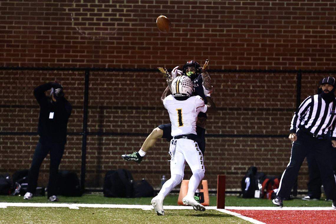 Owensboro’s Kingston Dillard pulled down a 30-yard touchdown catch over Woodford County’s Christopher Reed Jr. (1) that helped give the Red Devils a 35-0 lead late in the first half of the Class 5A state football semifinals at Rash Stadium in Owensboro on Friday.