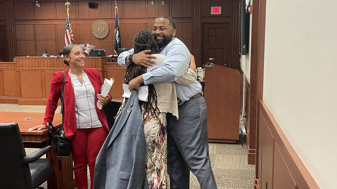 Sarah Williams hugs her attorney, Daniel Whitley, after she was acquitted on three of four charges in a trial that stemmed from her arrest at a racial justice protest in 2020.