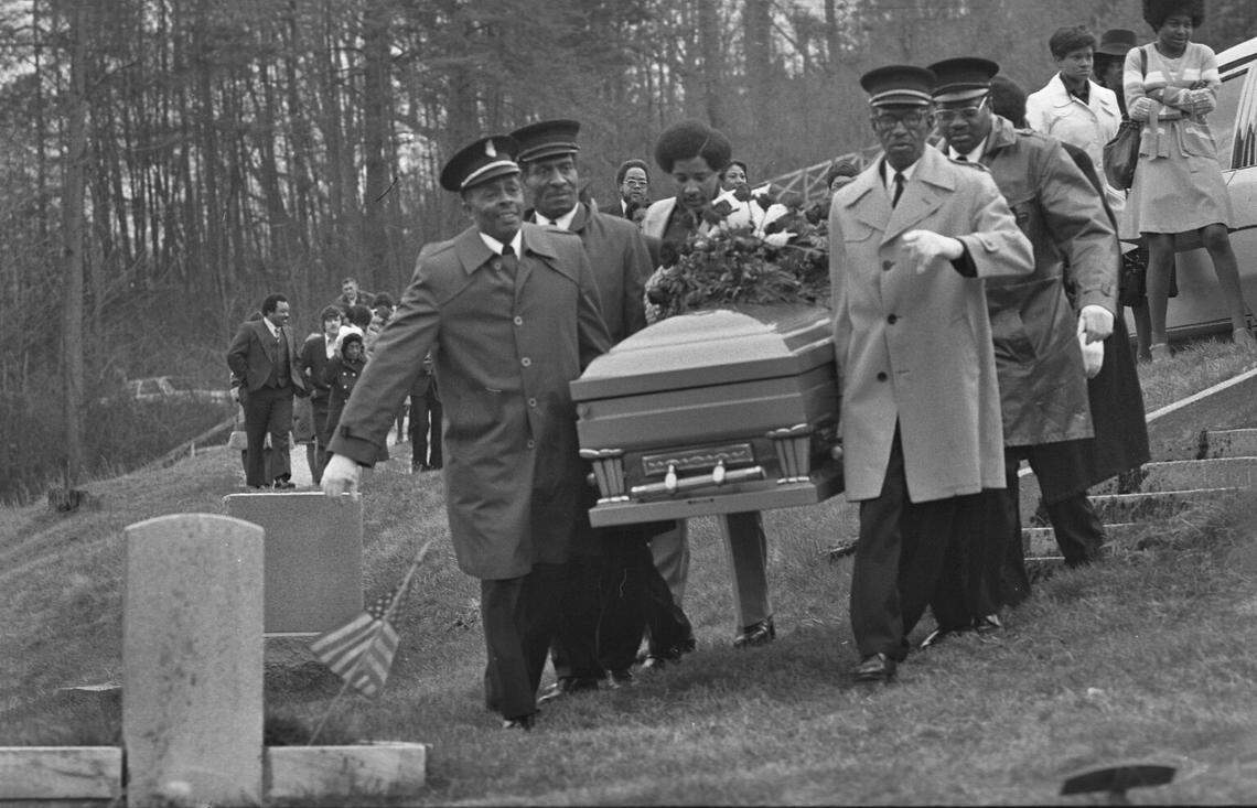 A Scotia victim is carried to his final resting place.