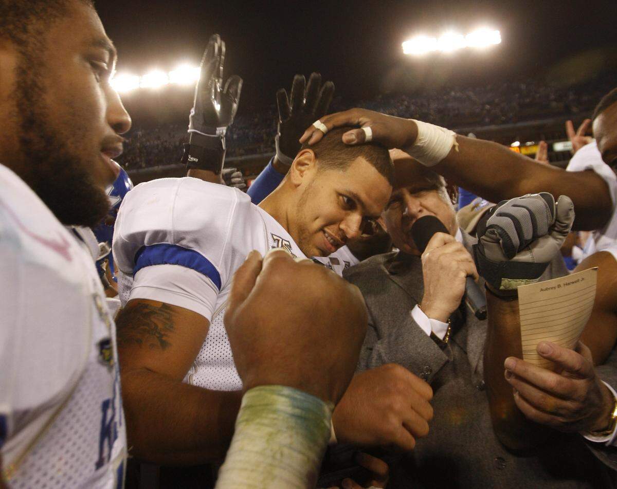 Kentucky quarterback Andre Woodson was congratulated as he was presented the MVP trophy after the Wildcats beat Florida State 35-28 in the 2007 Music City Bowl.