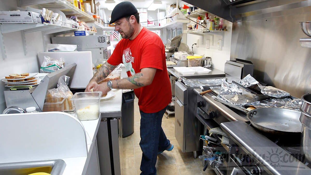 Jason Noto, owner of Mia Nonni food truck, prepared Italian food recently outside Lexington's West Sixth Brewing Co.