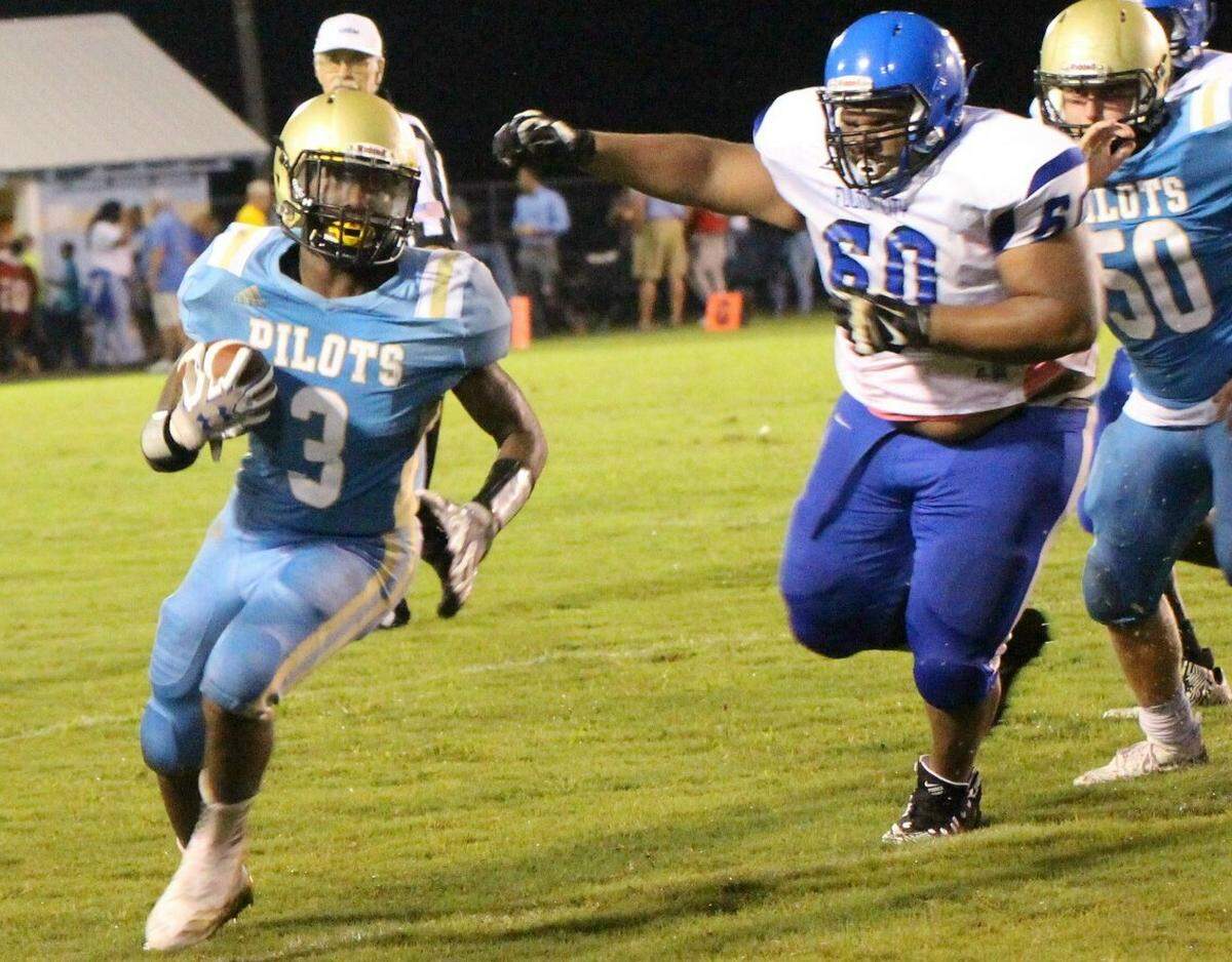Fulton County running back Caleb Kimble, left, has rushed for 695 yards and 14 touchdowns through three games this year. The Pilots are 3-0 for the first time since 1985.