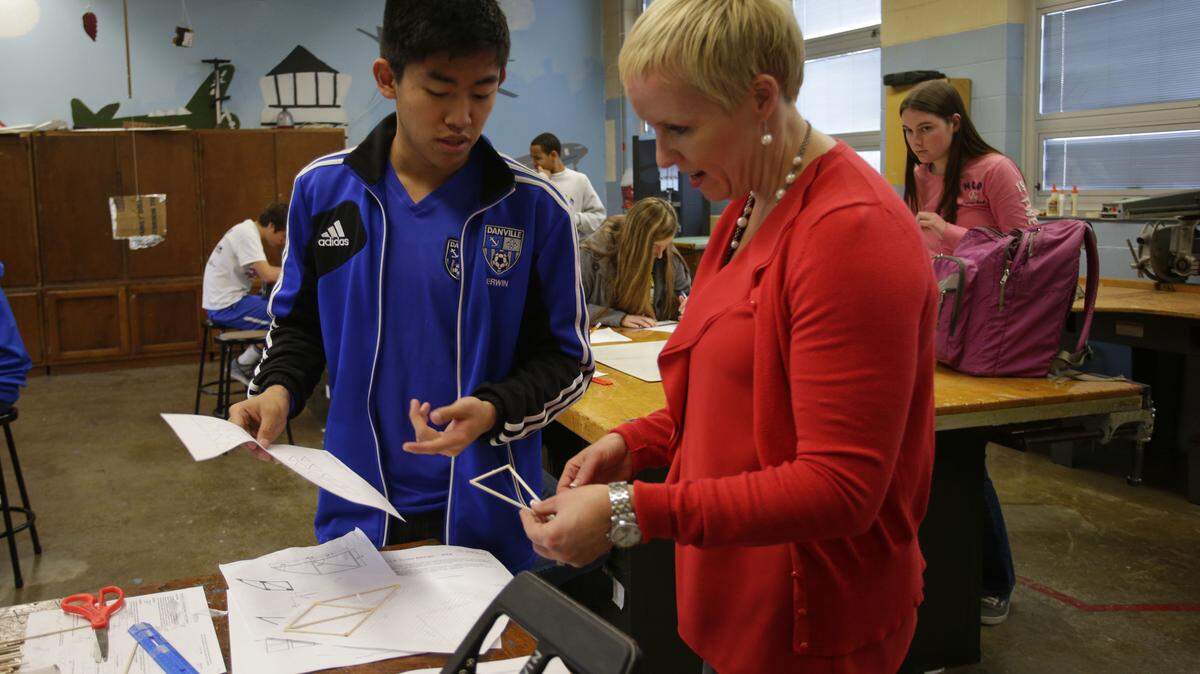 In this 2013 file photo, former Danville Independent School District Superintendent Carmen Coleman worked with then Danville High School senior Will Erwin as she visited classes. Coleman wanted then to eliminate some standardized tests for high school students and replace them with tests that reflect project-based learning.