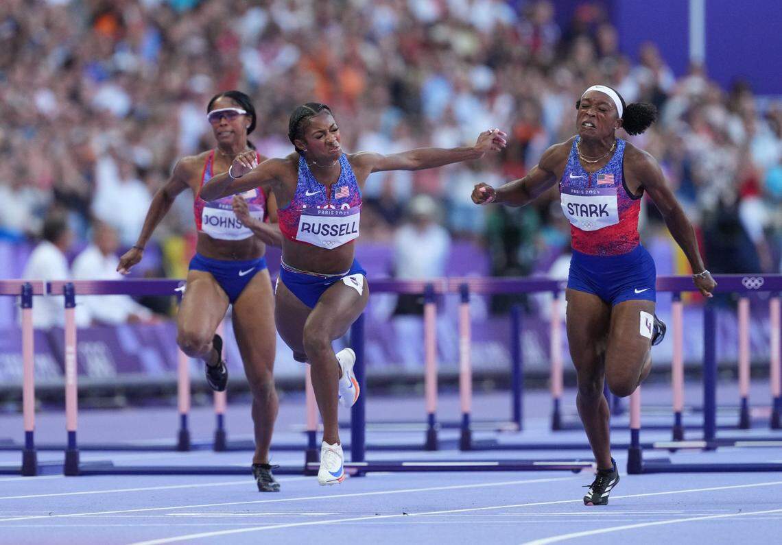Aug 10, 2024; Saint-Denis, FRANCE;  Masai Russell (USA) races Grace Stark (USA) and Alaysha Johnson (USA) in the women's 100m hurdles final during the Paris 2024 Olympic Summer Games at Stade de France. Mandatory Credit: James Lang-USA TODAY Sports